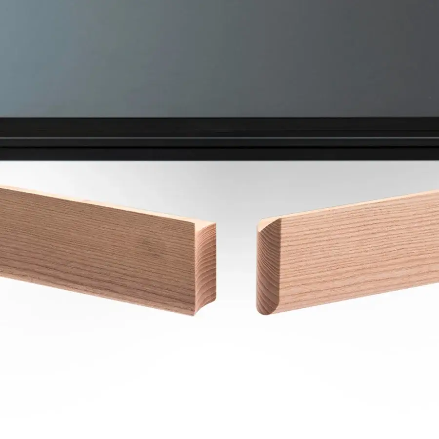 Elegant Bross Amalong table in light solid ash with a black framed tabletop showcasing a unique heart-shaped leg imprint
