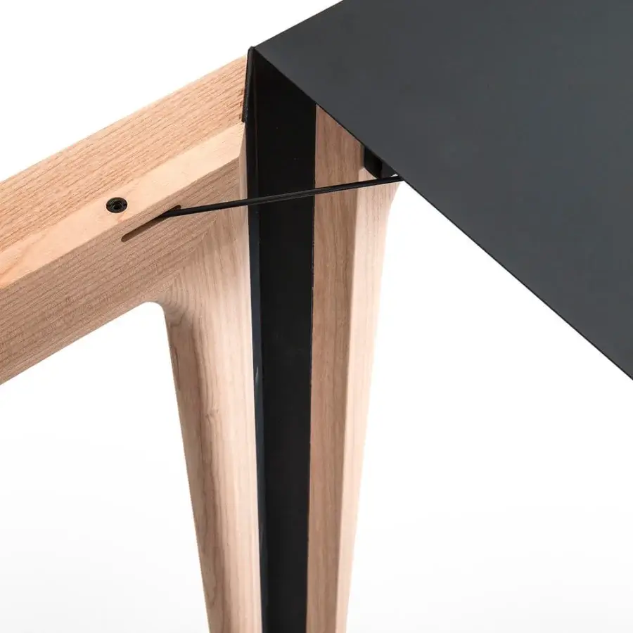 Distinguished Bross Amalong table with a rectangular black top and light solid ash frame built with vertical accents