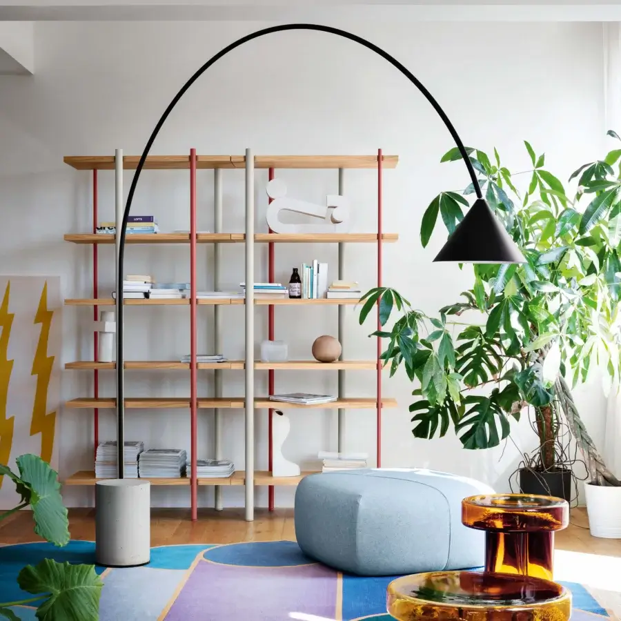 Distinctive Miniforms Ozz floor lamp with a curved matte black metal shaft and cylindrical concrete base