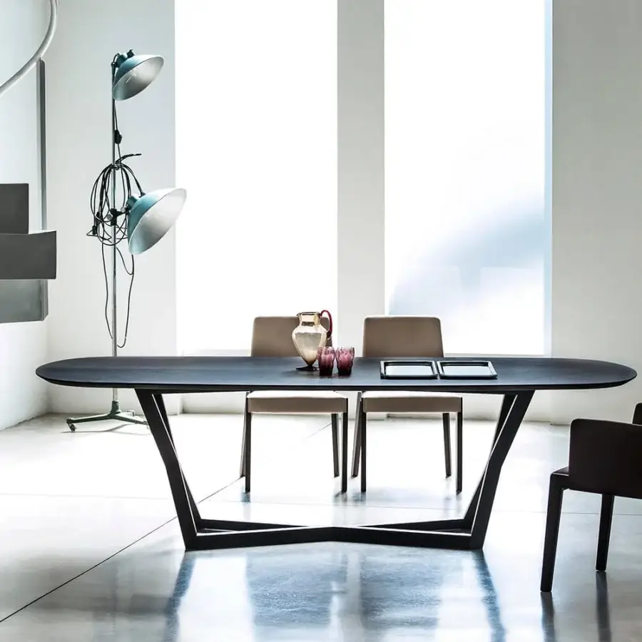 Distinguished Bross Bridget table with a solid oak frame and oval clear glass top in a dark matte finish