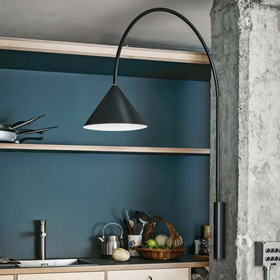 Superior Miniforms Ozz wall lamp with a curved black metal arm directing light from a cylindrical base in matte finish