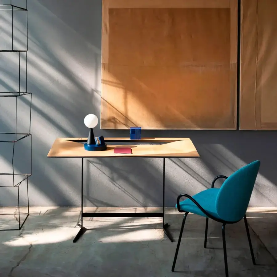 Distinguished Bross Cut desk crafted in lacquered metal with a warm-toned wood top and flared legs for a functional aesthetic identity
