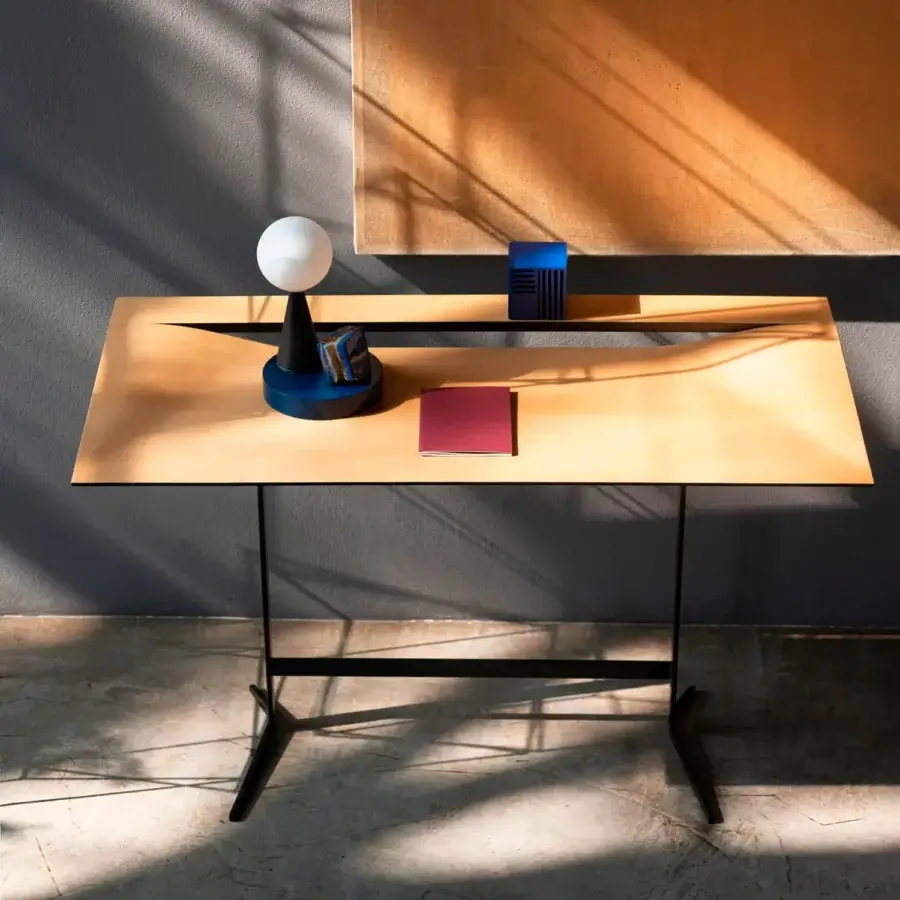 Exceptional Bross Cut desk crafted in light wood with a matte finish and a black lacquered metal frame featuring a diagonal cut detail