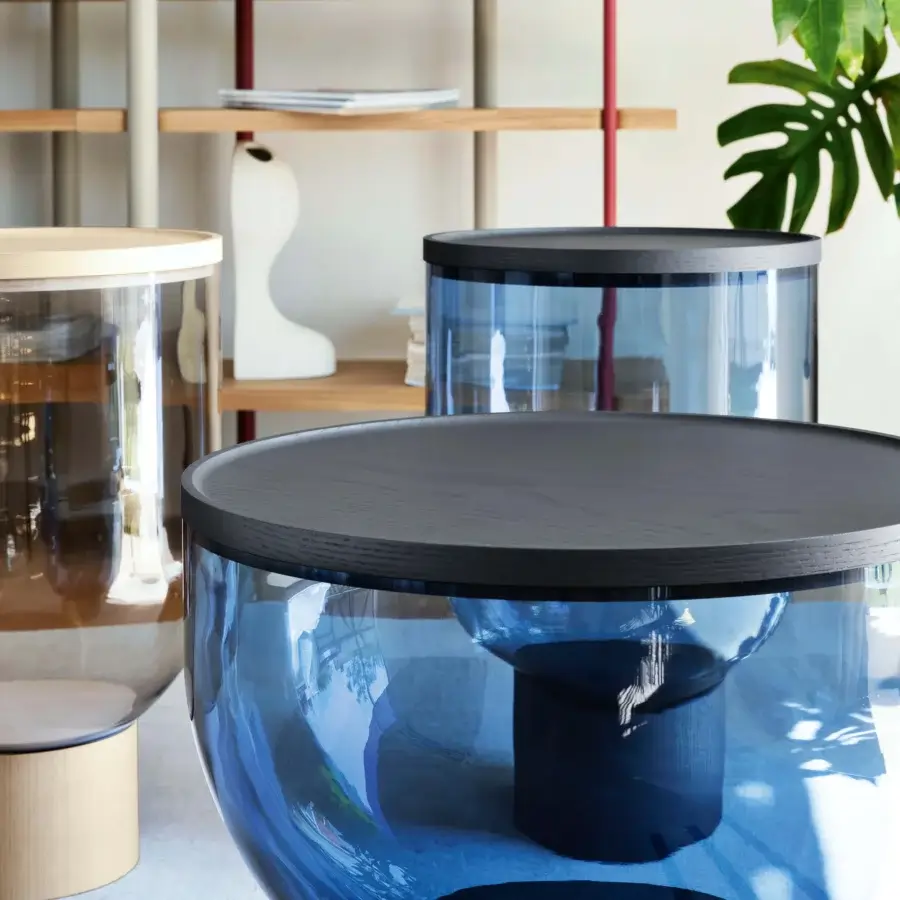 Distinguished Miniforms Mastea coffee table with blue-tinted glass body and dark matte wooden top and cylindrical base
