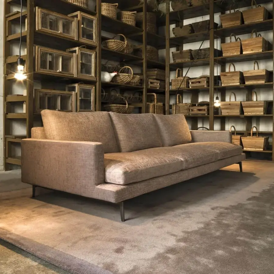 Superior Verzelloni Larsen sofa with light brown textured textile upholstery and dark metal feet crafted with solid wood framing