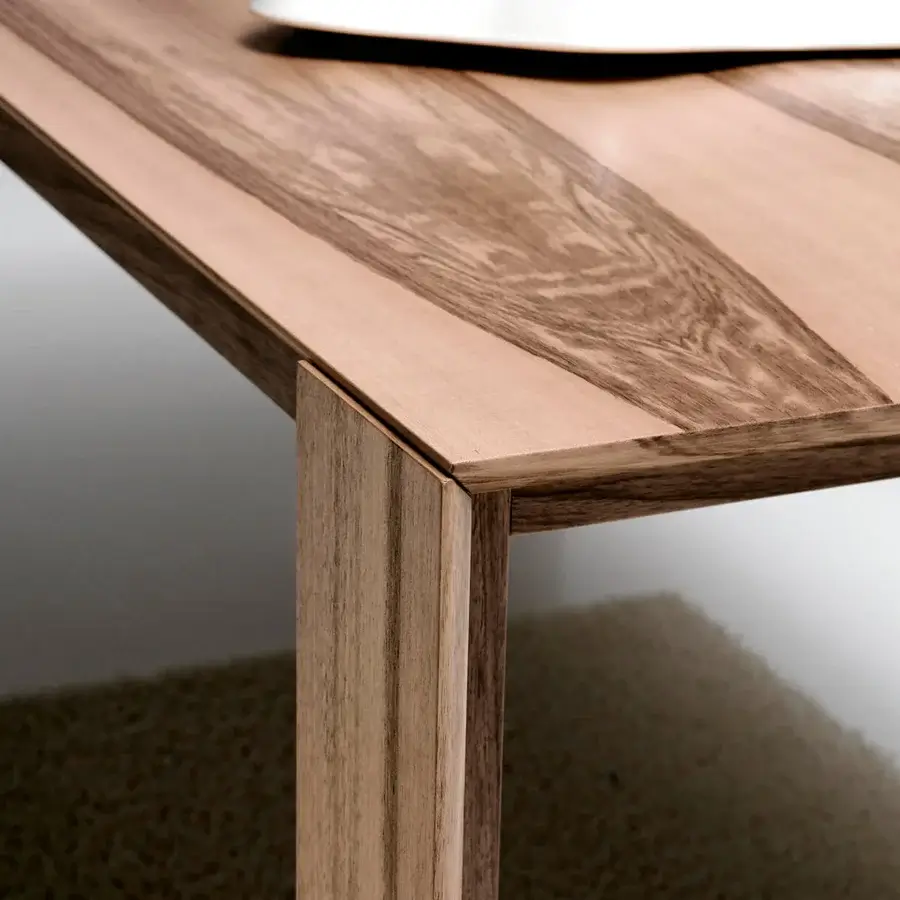 Elegant Bross Joy extendable table crafted in oakwood with light brown tone and darker grains exhibiting a smooth finish
