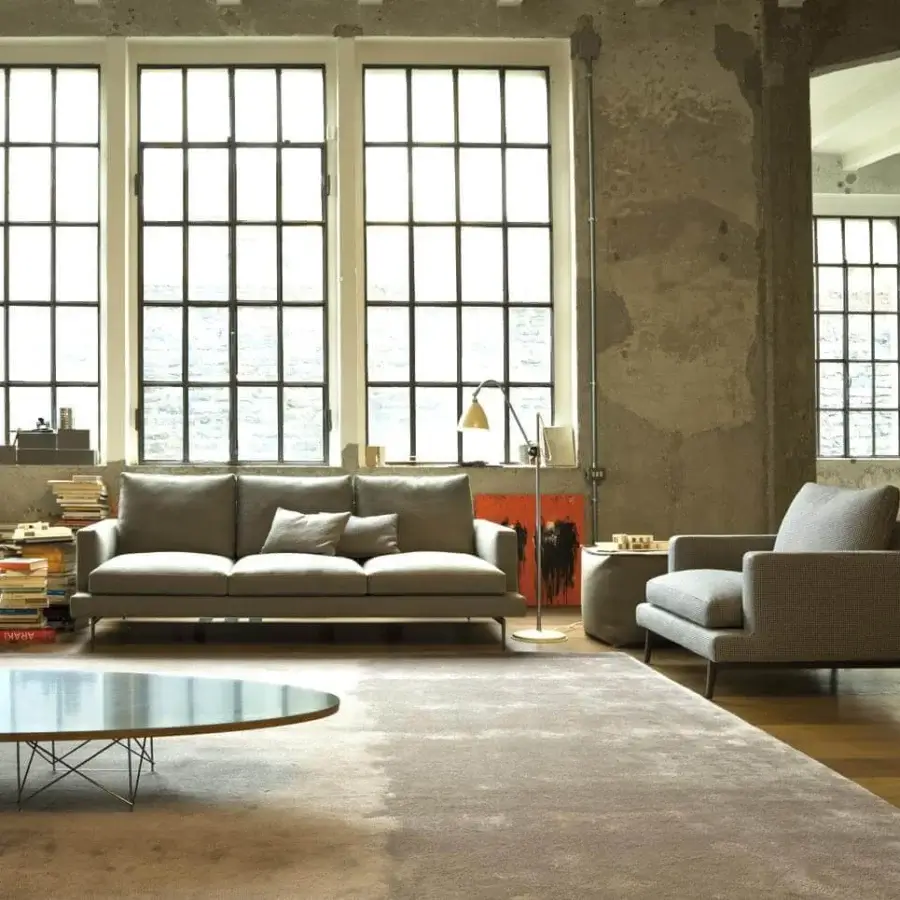 Distinguished Verzelloni Larsen sofa with interwoven elastic bands and uniform gray textile upholstery exhibiting a matte finish