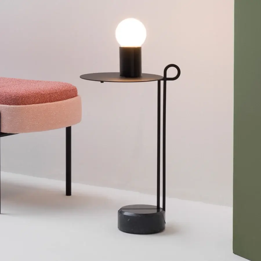 Distinguished Bross Loop coffee table with looping matte black steel and Black Marquina marble base for a contemporary aesthetic