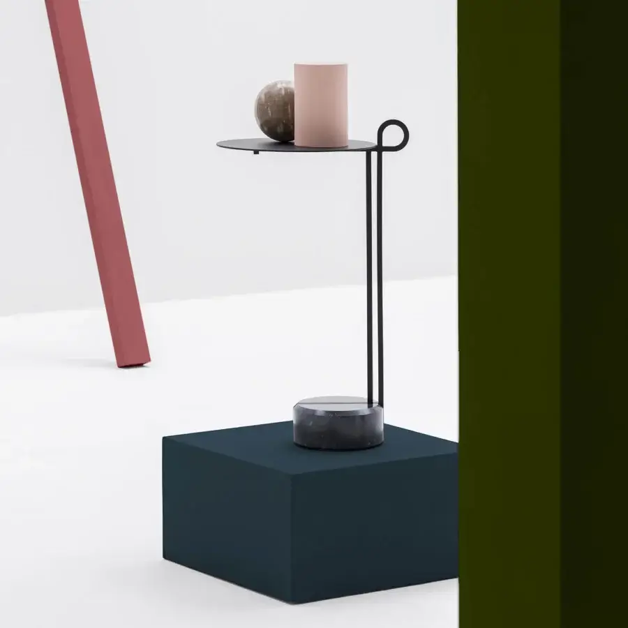Elegant Bross Loop coffee table with a looping slender black finished steel frame and Black Marquina marble base