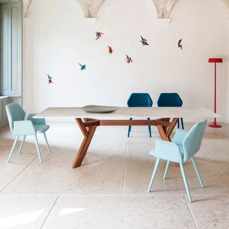 Distinctive Bross Ava table with a light cream tabletop and warm brown angled wooden base built with metal supports