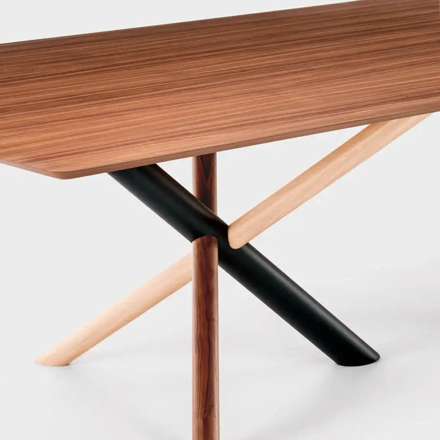 Distinguished Bross W table crafted in rich brown wood with a dynamic American walnut and white aniline oak base in RAL 7016