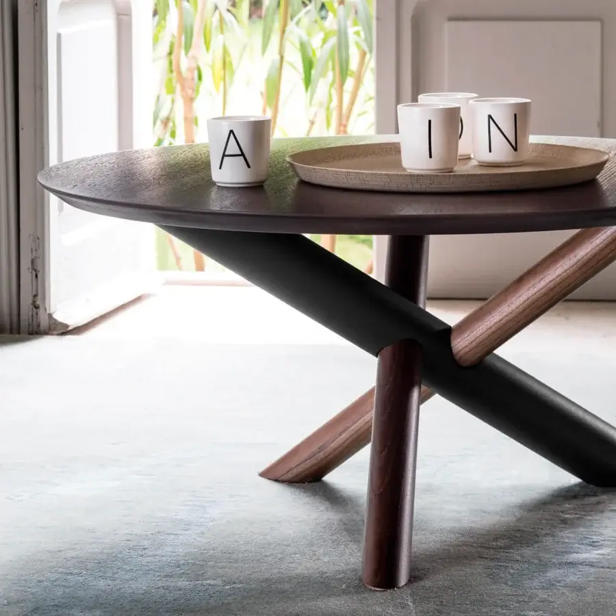 Exceptional Bross W coffee table with dark brown wood tabletop and intersecting American walnut, oak, and RAL 7016 metal supports
