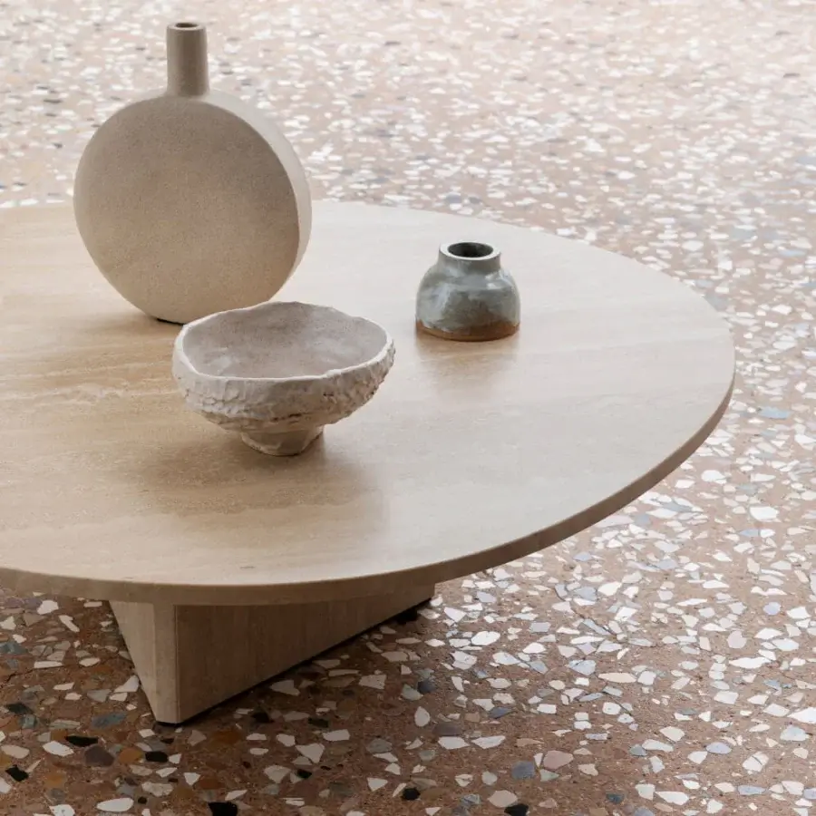 Exceptional Miniforms Albio coffee table in travertine marble with a sleek faceted triangular base and warm beige tones