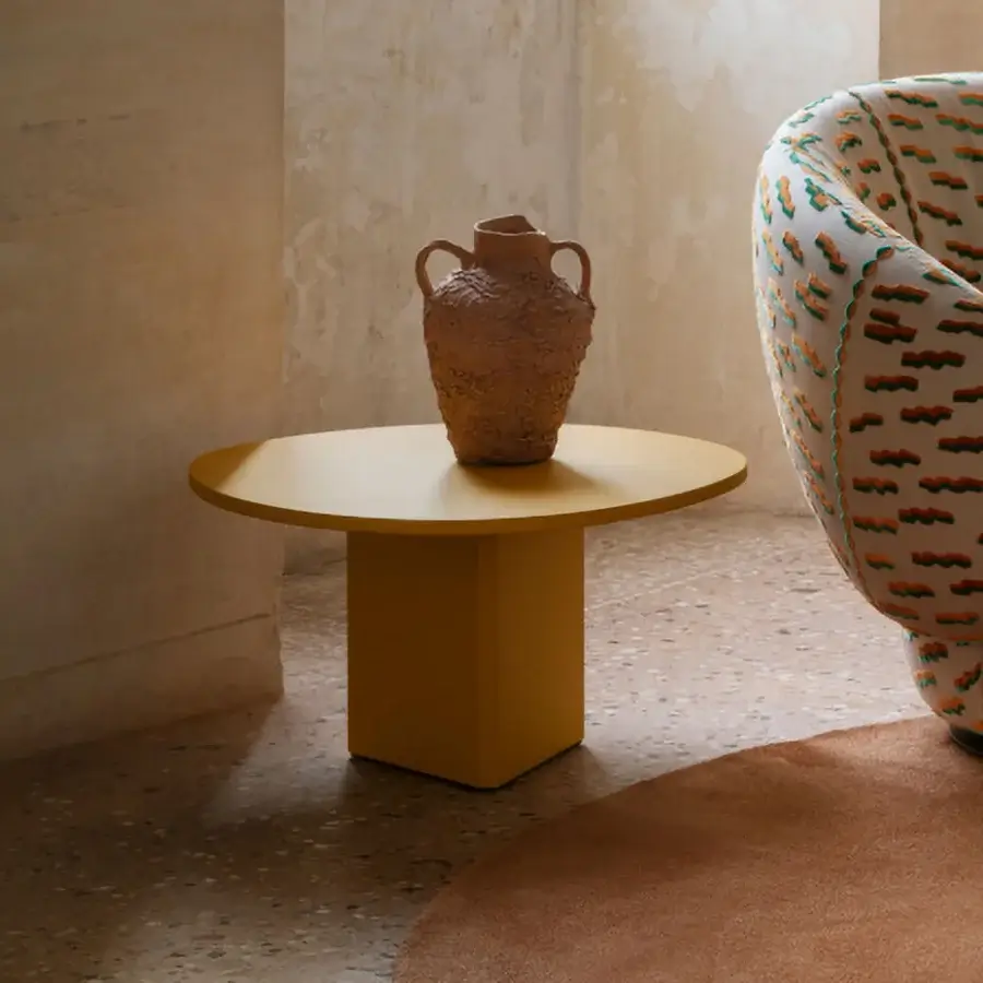 Elegant Miniforms Albio coffee table with a round tabletop and cube base in mustard yellow lacquer