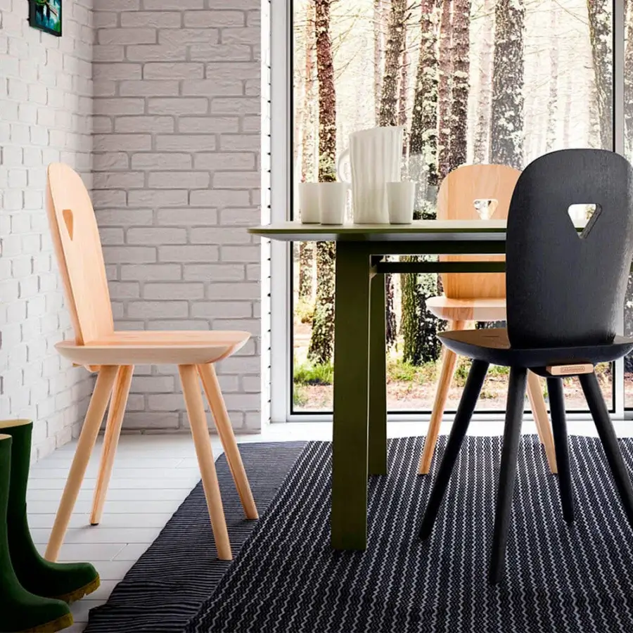 Exceptional Casamania La Dina chair crafted from solid wood with a matte black finish and rounded lines