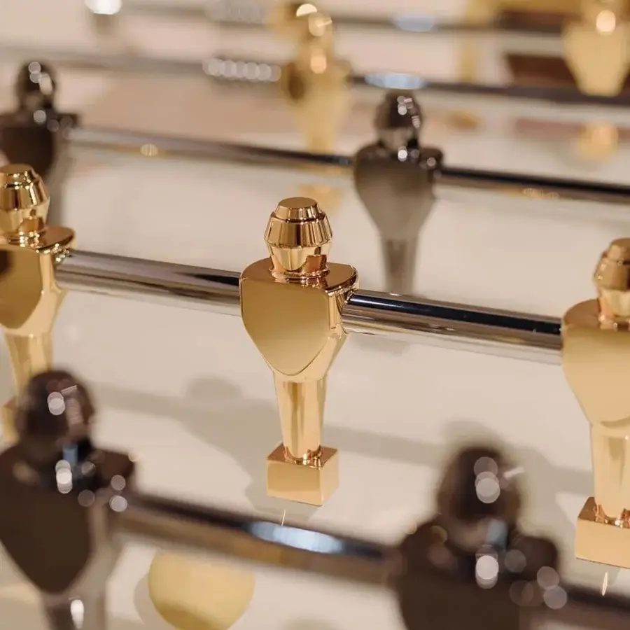 Exceptional Vismara Stadium foosball built with lacquered wood and tempered glass, showcasing aluminum figures plated in gold and black nickel