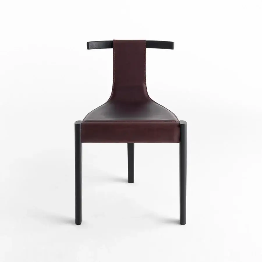 Distinguished Casamania Pablita chair with ashwood frame connected with stainless steel and carbon fiber, upholstered in burgundy premium leather