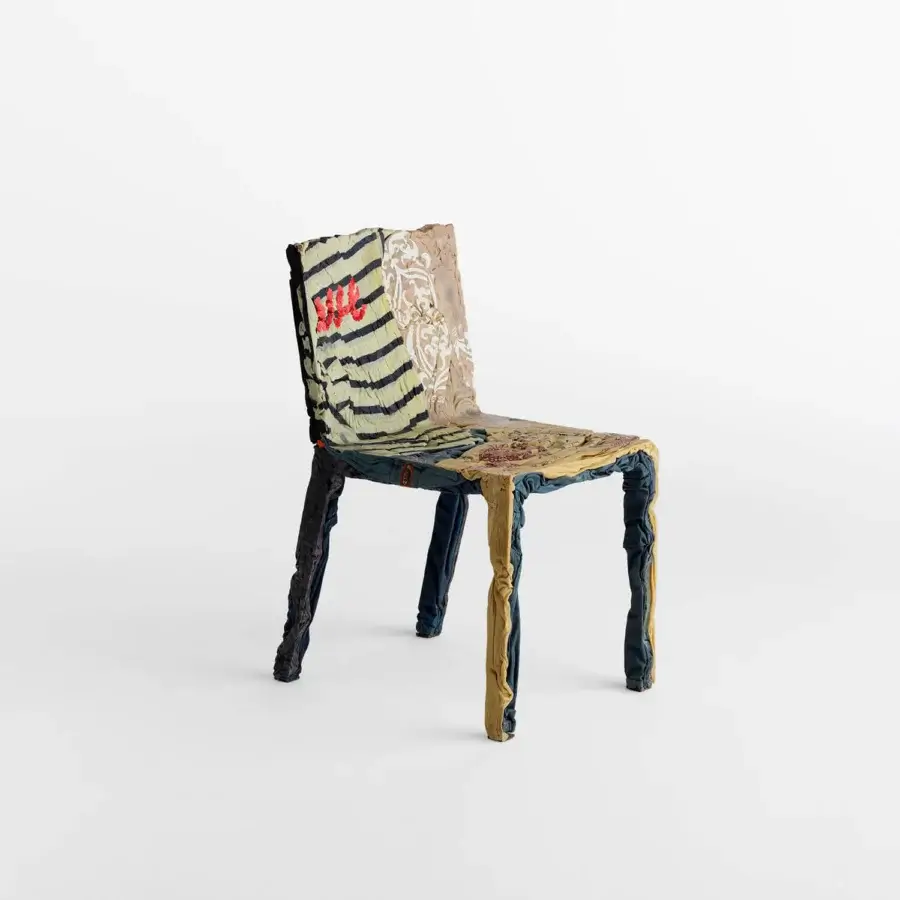 Exceptional Casamania Rememberme chair crafted in Italy with a dense textile wrap of beige, blue, yellow and black recycled jeans resin