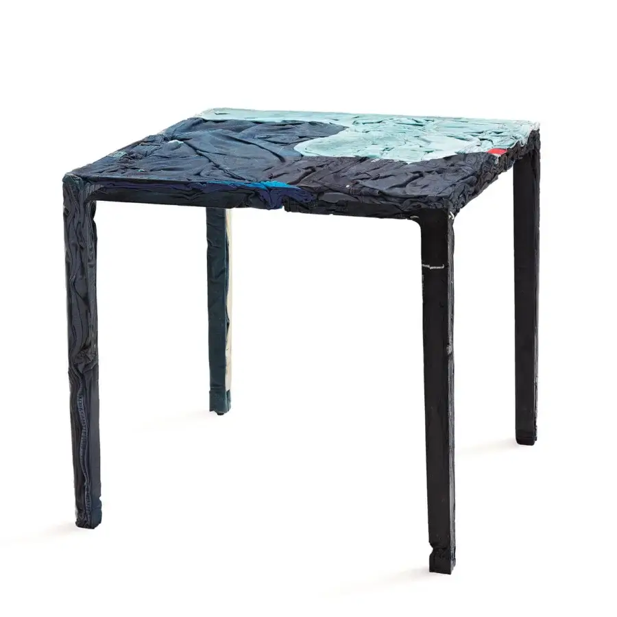 Superior Casamania Rememberme bistrot table crafted in Italy with layered dark and light blue molded jeans and hardening resin