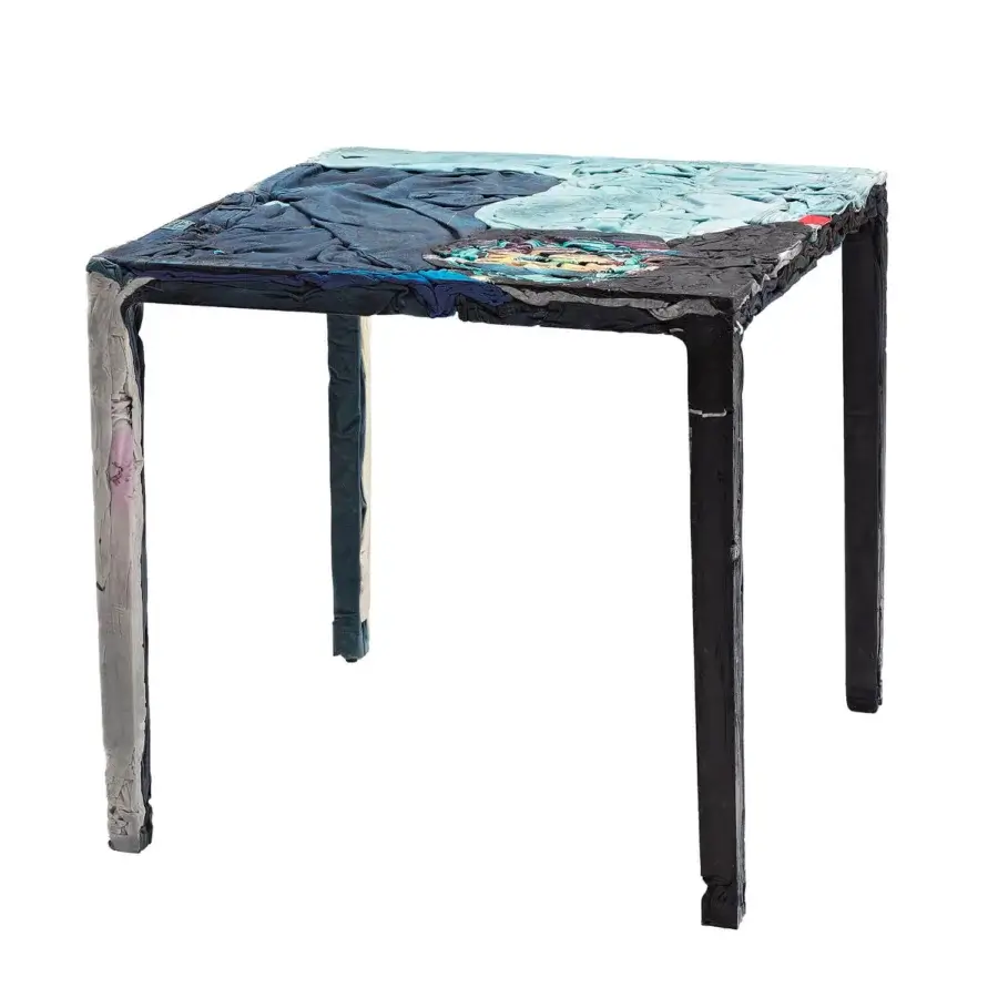 Elegant Casamania Rememberme bistrot table crafted in Italy with textured recycled jeans and cotton in blues, grays, blacks, and a matte finish