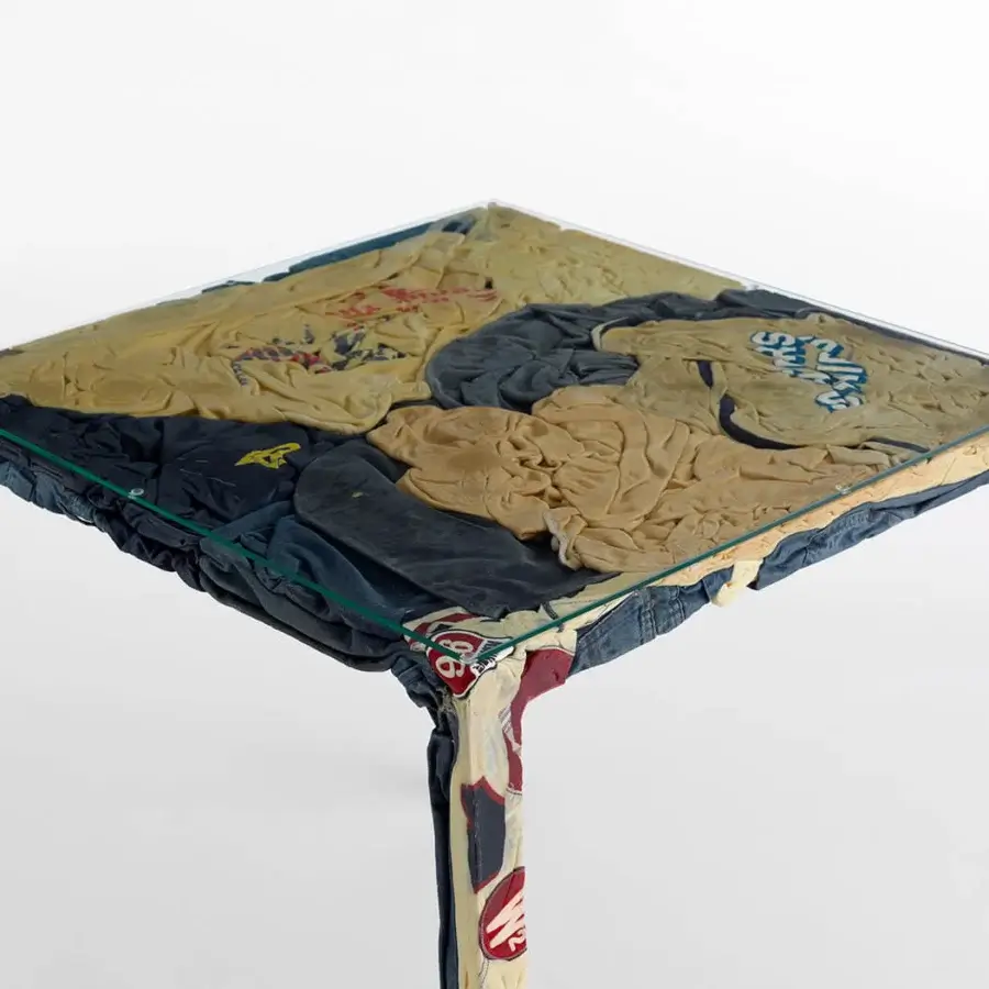 Distinctive Casamania Rememberme bistrot table built in Italy with upcycled jeans, cotton, and clear glass top