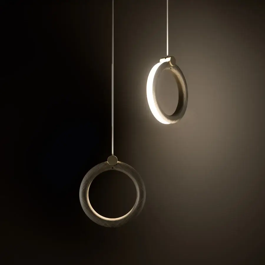 Sophisticated Ozzio Italia Sole suspension lamp with two rings exhibiting a visible wood grain pattern and warm bright light