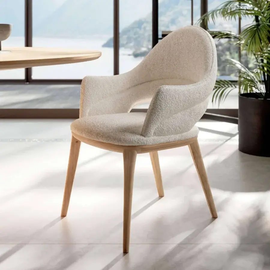 Exceptional Ozzio Italia Baia chair with sinuous lines and curves built with solid ash and textured off-white textile upholstery