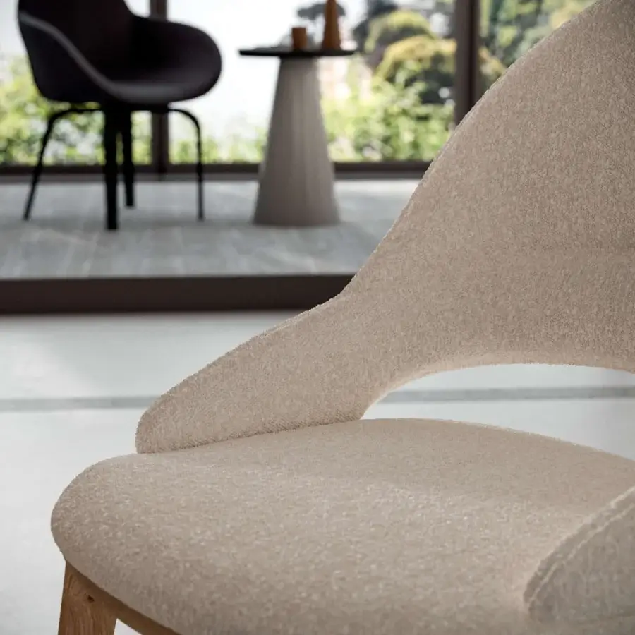 Distinguished Ozzio Italia Baia chair with sinuous lines crafted in solid ash and textured matte textile upholstery