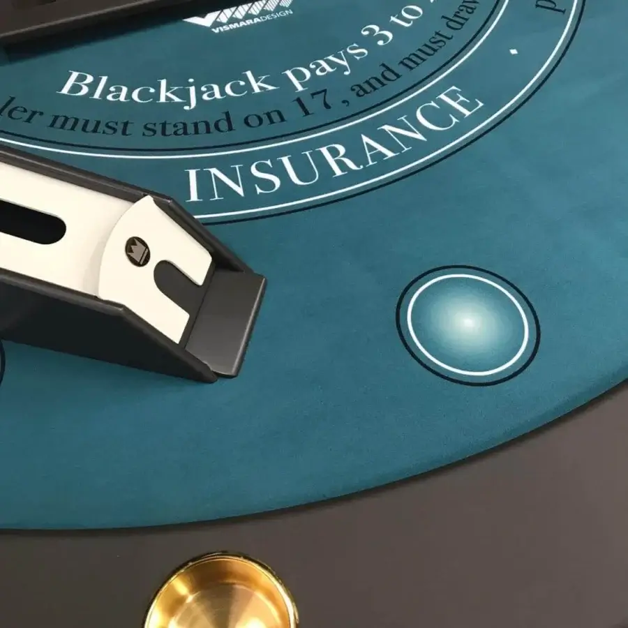 Superior Vismara Napoleon blackjack table with teal printed microfiber, dark gray lacquered edges and polished gold steel cup holders