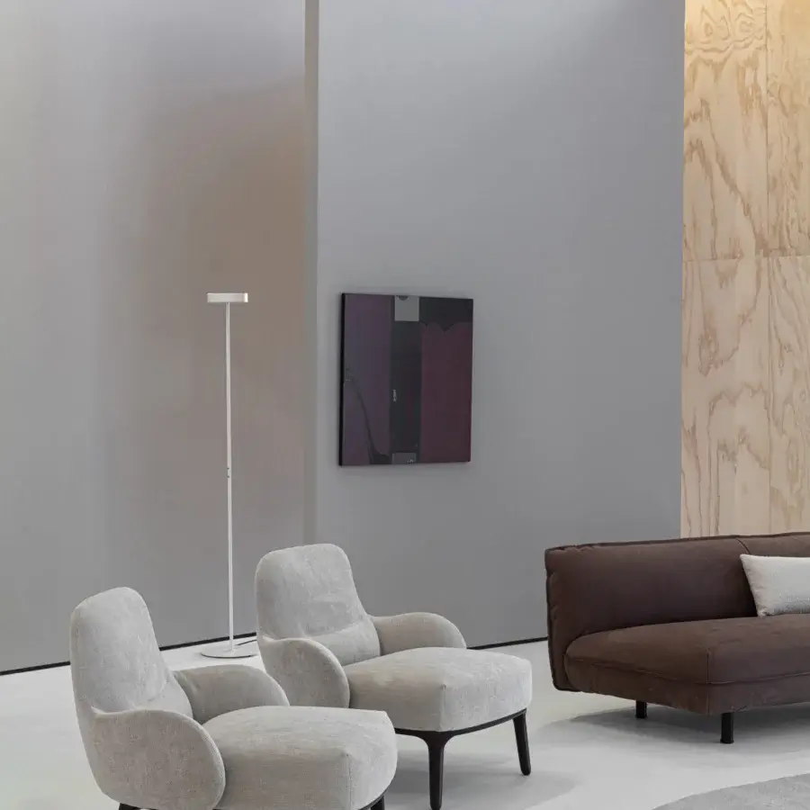 Harmonious Cierre1972 Woody lounge chair in light grey textile with short dark brown wooden legs showcases refined minimalist aesthetics