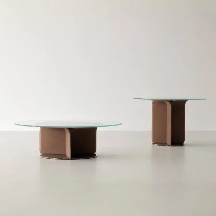 Innovative Cierre1972 Helix coffee table with a round glass top and warm brown leather-like helix base