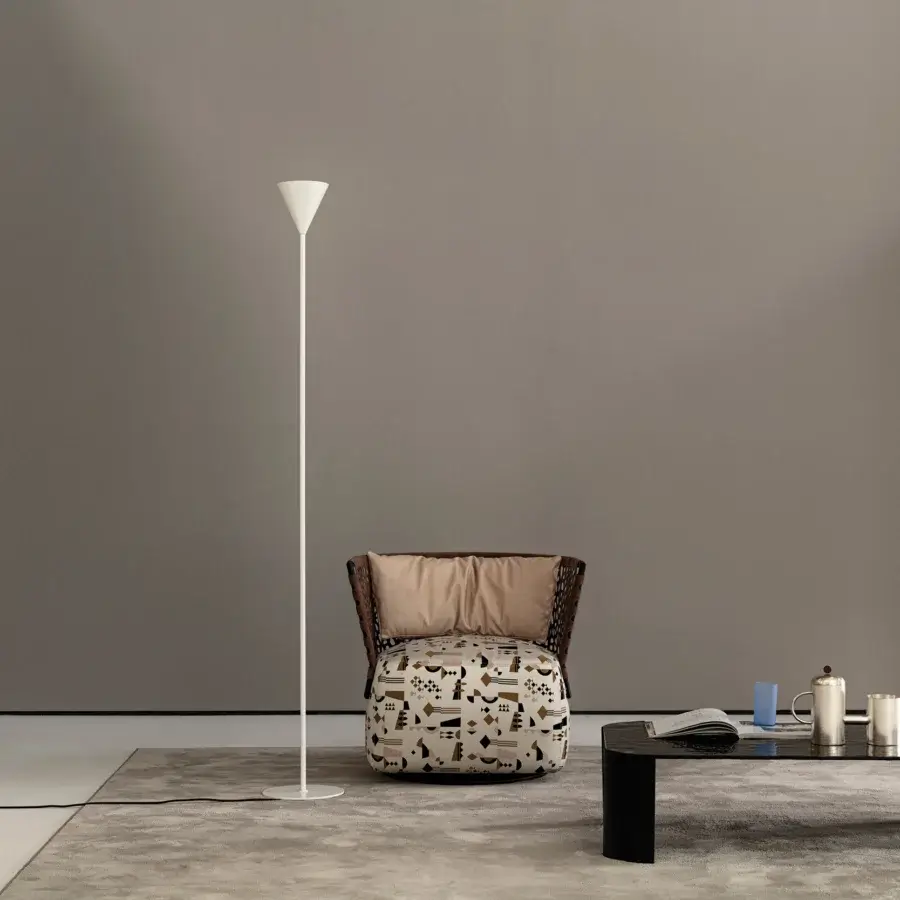 Elegant Cierre1972 Riviera coffee table with woven frame and patterned textile cushion in brown, black, and white tones