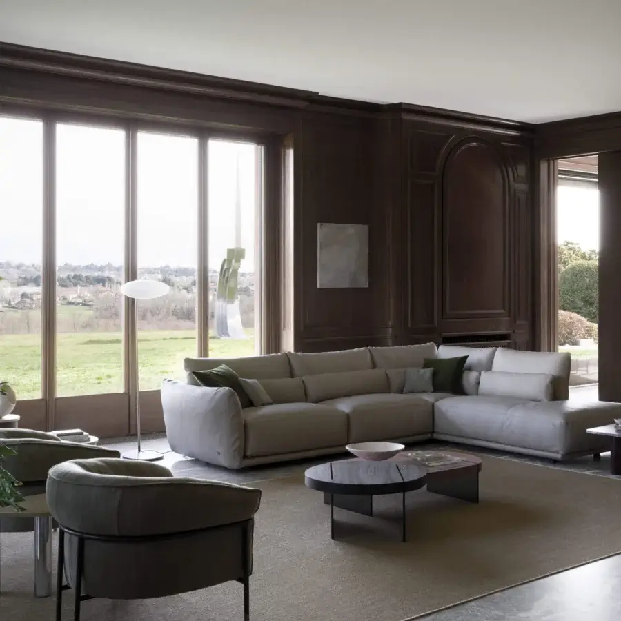 Elegant Cierre1972 Clift sectional with extra-deep seating and soft backrests in light neutral textile with matte finish
