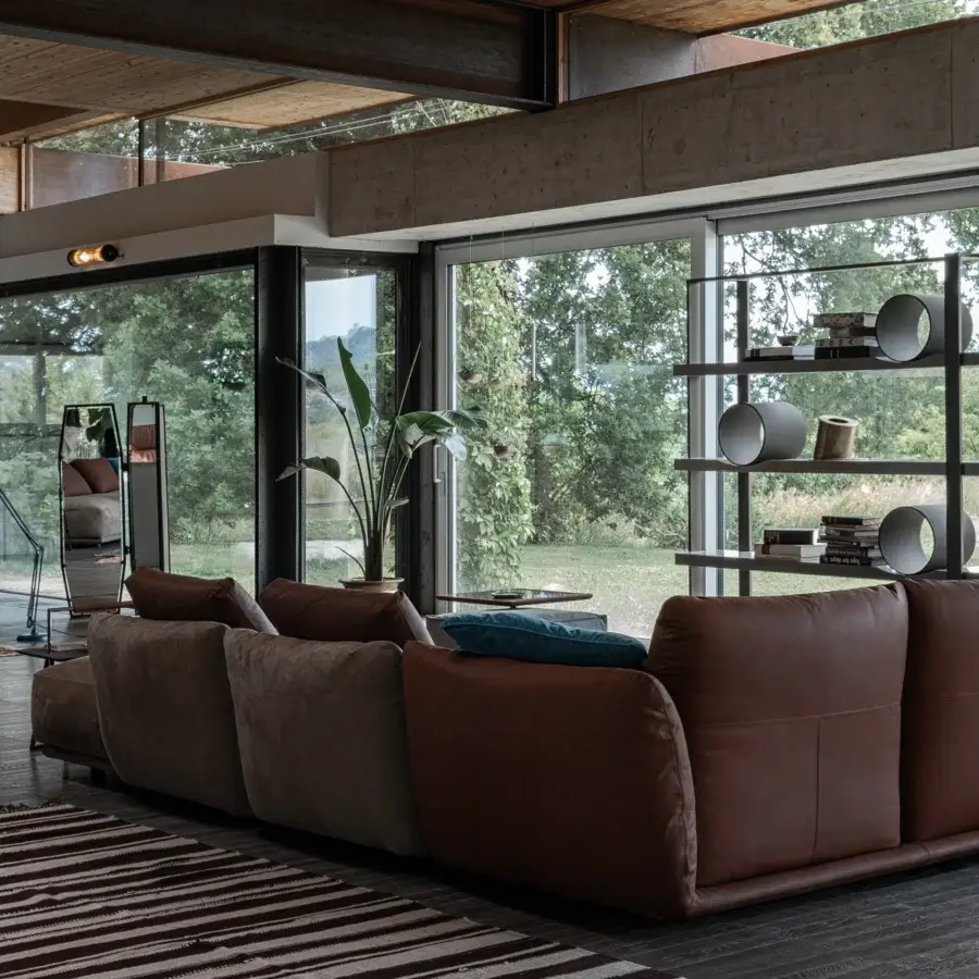 Harmonious Cierre1972 Clift sectional built in Italy with lustrous leather and matte textile upholstery in dark brown tones