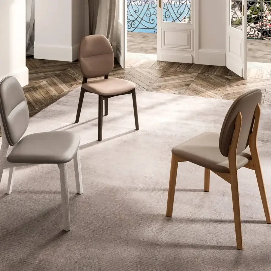 Distinguished Ozzio Italia Giotto chair crafted with tan leather upholstery and natural-toned solid ash wood frame
