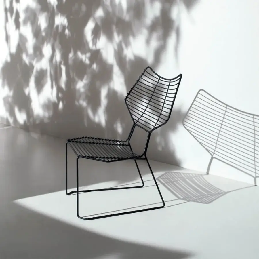 Superior Casamania Alieno lounge chair with angular shape and ergonomic curved backrest in painted metal