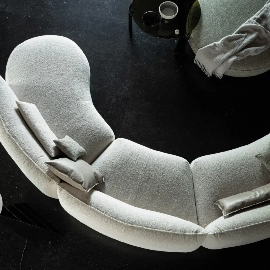 Elegant Cierre1972 Seed sectional with light textile upholstery and curved organic form crafted in Italy