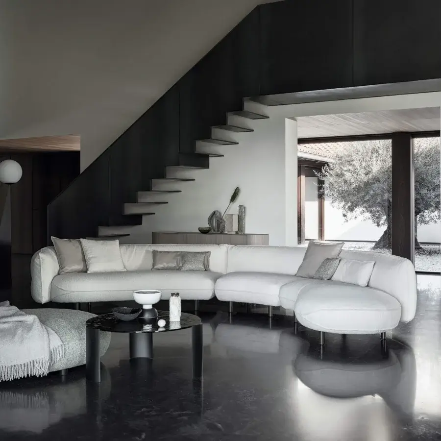 Distinguished Cierre1972 Seed sectional upholstered in light cream textured textile with a matte finish