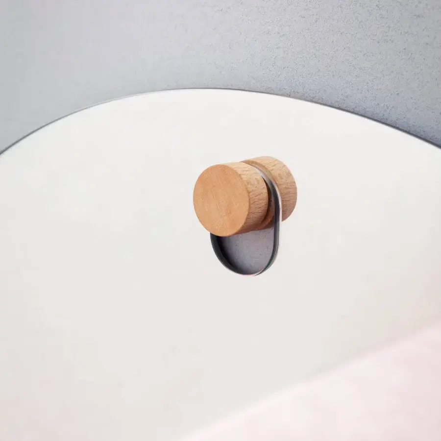 Exceptional Miniforms Les Brother mirror crafted in Italy with a light-toned wooden knob and elegant neutral tones
