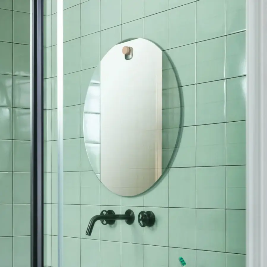 Exceptional Miniforms Les Brother mirror crafted in Italy with smooth glass and a signature wooden beauty spot wall mount