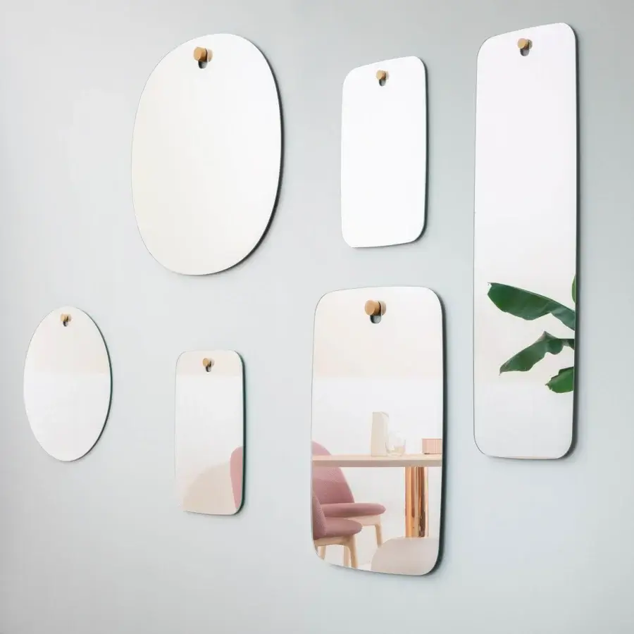 Distinguished Miniforms Les Brother mirror collection crafted in Italy with light neutral backing and wood mounting detail