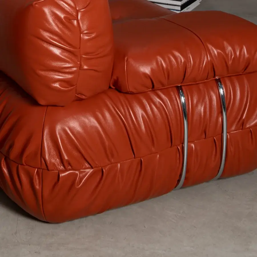 Distinguished Cierre1972 Option sofa with reddish-brown leather-like upholstery and glossy metal bands offering luxurious comfort