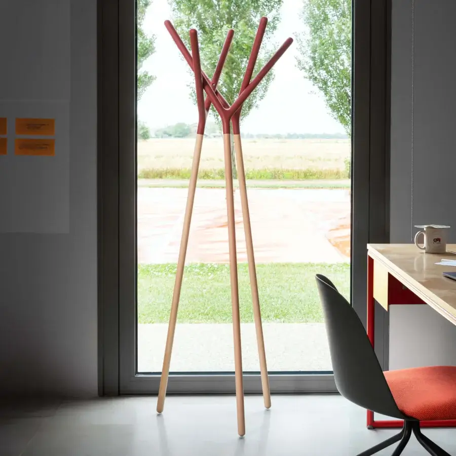 Distinguished Miniforms Game of Trust coat stand crafted in Italy with reddish-brown extensions and natural tone smooth wooden legs