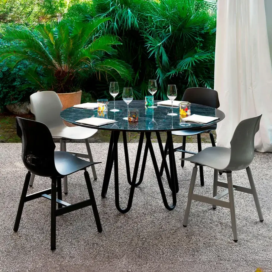 Distinguished Casamania Meduse table with smoked glass top and interwoven black painted metal base crafted in Italy