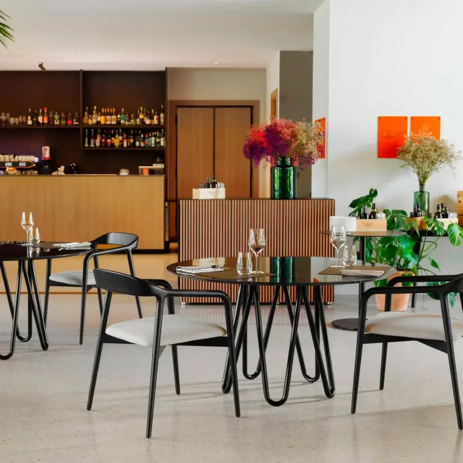 Exceptional Horm Velasca armchair crafted in solid ash with a sleek black finish and looping wave-like form