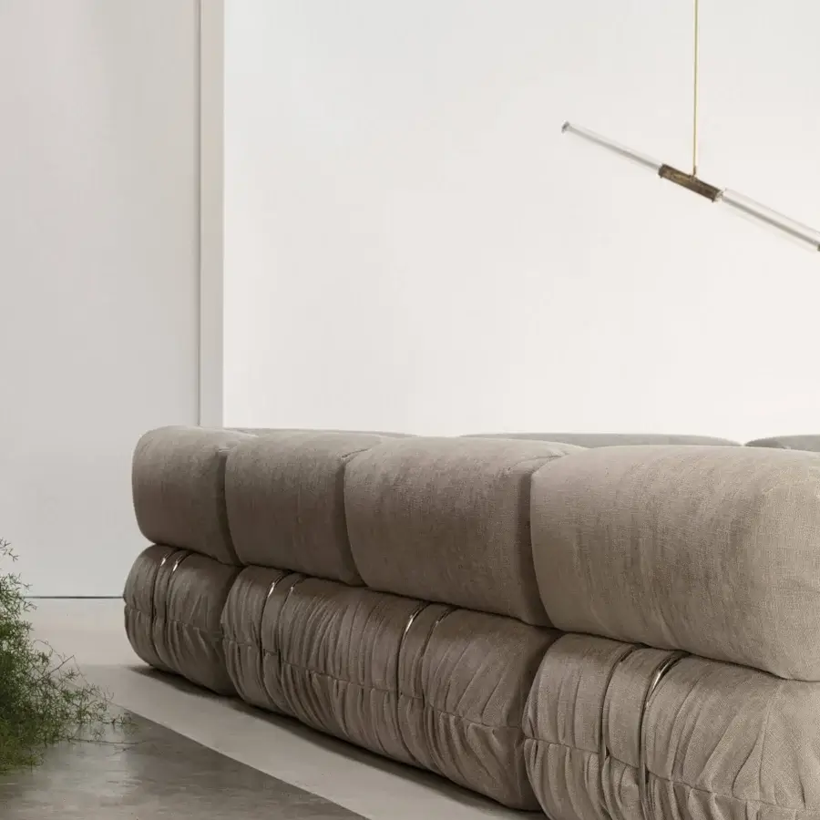 Distinguished Cierre1972 Option sectional with muted beige-gray textile upholstery and sleek metal bands offering luxurious comfort