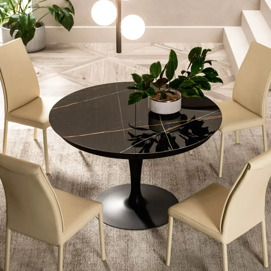 Distinguished Ozzio Italia Eclipse table with dark marble-like top and glossy finish built upon a sleek black pedestal base