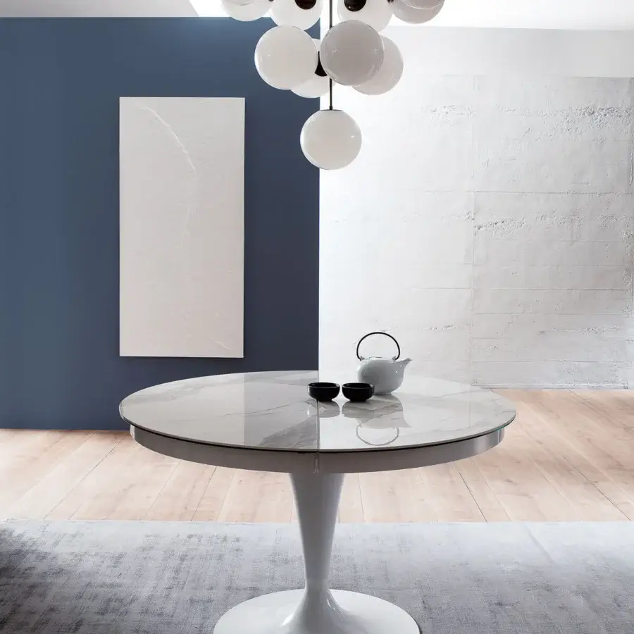 Distinguished Ozzio Italia Eclipse table with glossy light top exhibiting marble-like veining and smooth white pedestal base