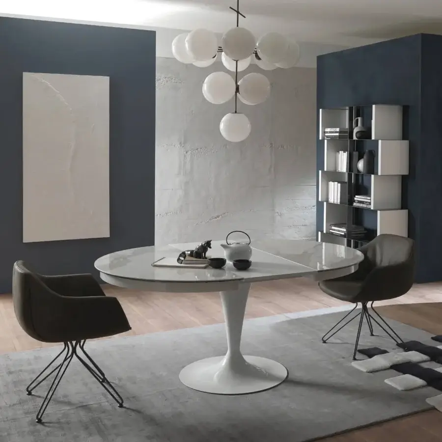 Distinguished Ozzio Italia Eclipse table with a round glossy tabletop and smooth white pedestal base offering hidden extension