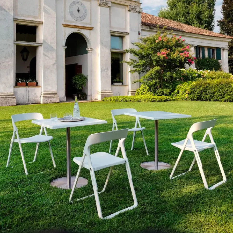 Sophisticated Casamania T1 Bistrot Protected Outdoor table with white HPL top and silver-toned metal base crafted in Italy